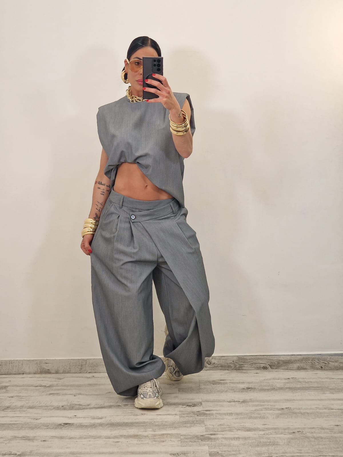 Sleeveless ruffled top + asymmetrical pants