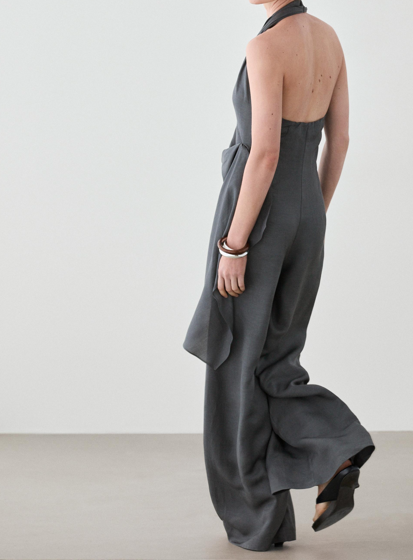 Asymmetric draped jumpsuit