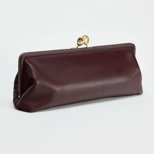 Elongated metal trim leather clutch bag