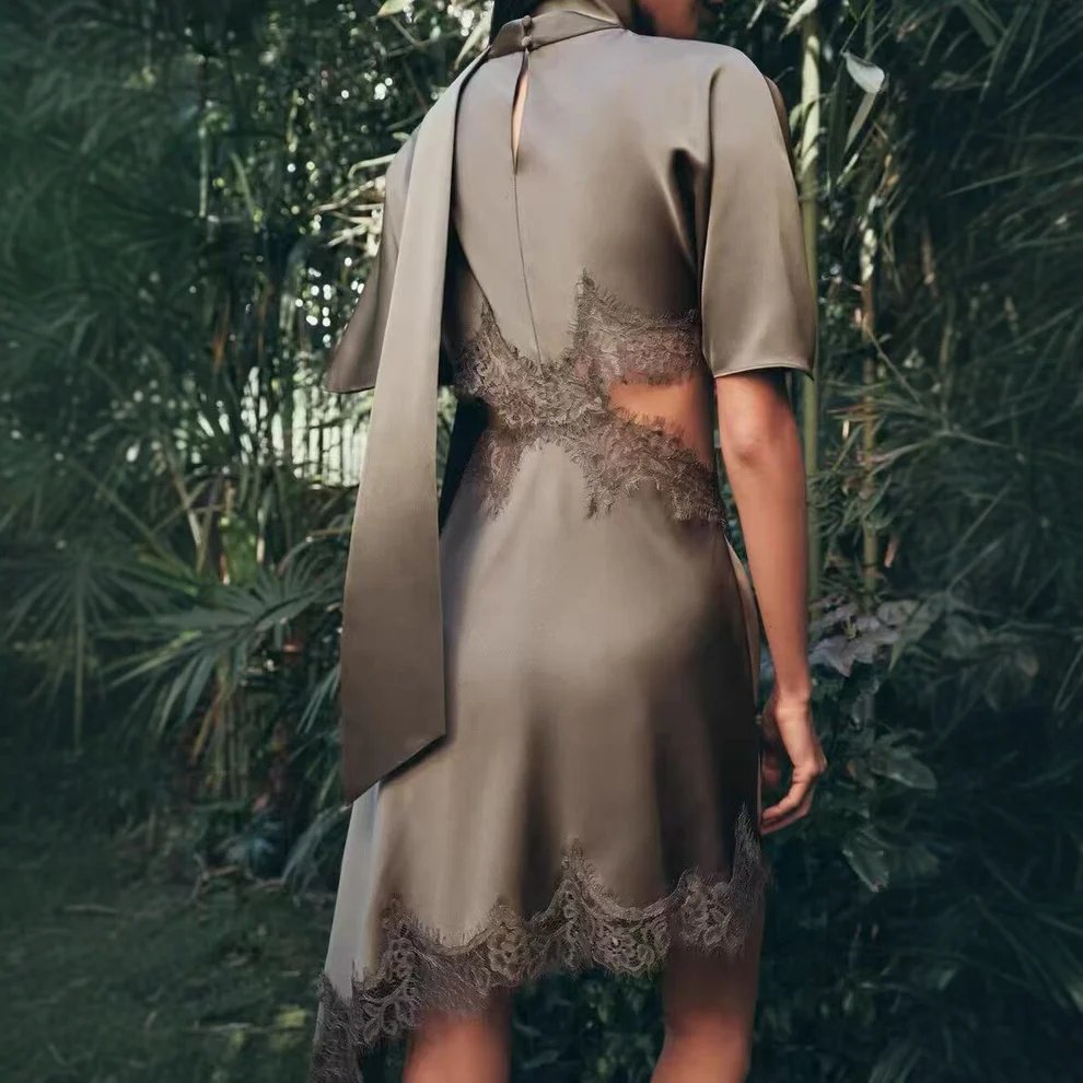 Silk satin dress with lace cutout design at the waist