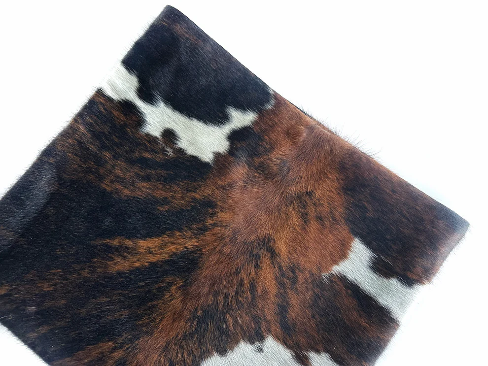 Three-tone cow print calfskin rolled edge clutch