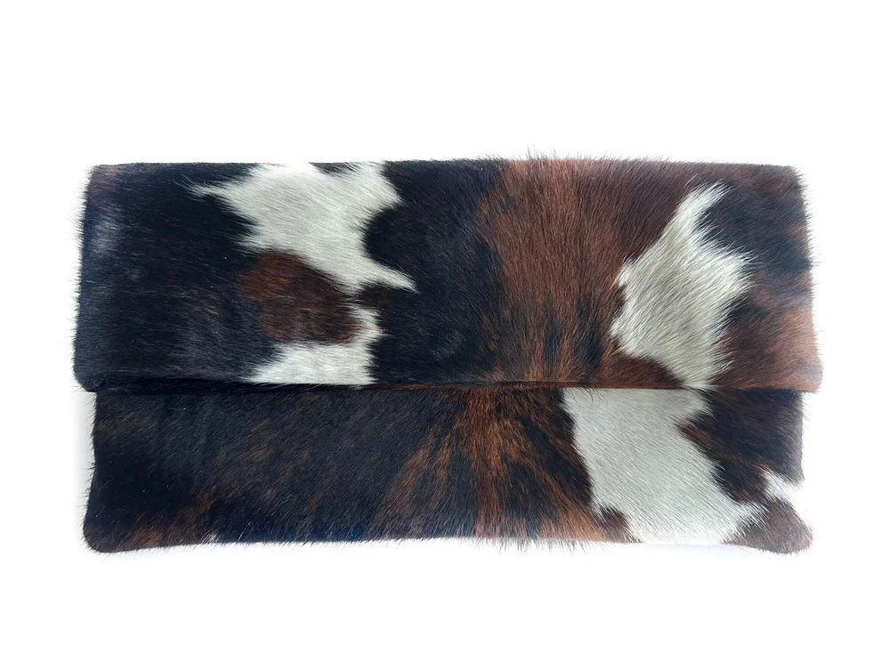 Three-tone cow print calfskin rolled edge clutch