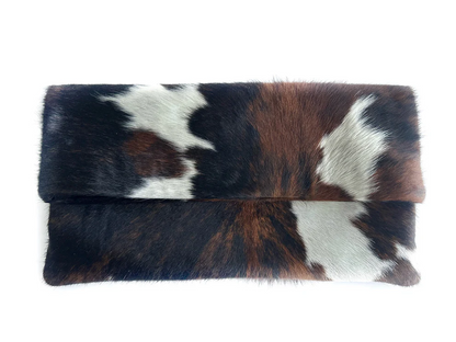 Three-tone cow print calfskin rolled edge clutch