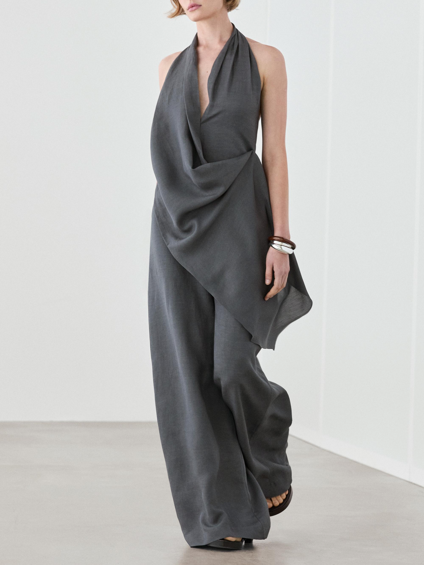 Asymmetric draped jumpsuit