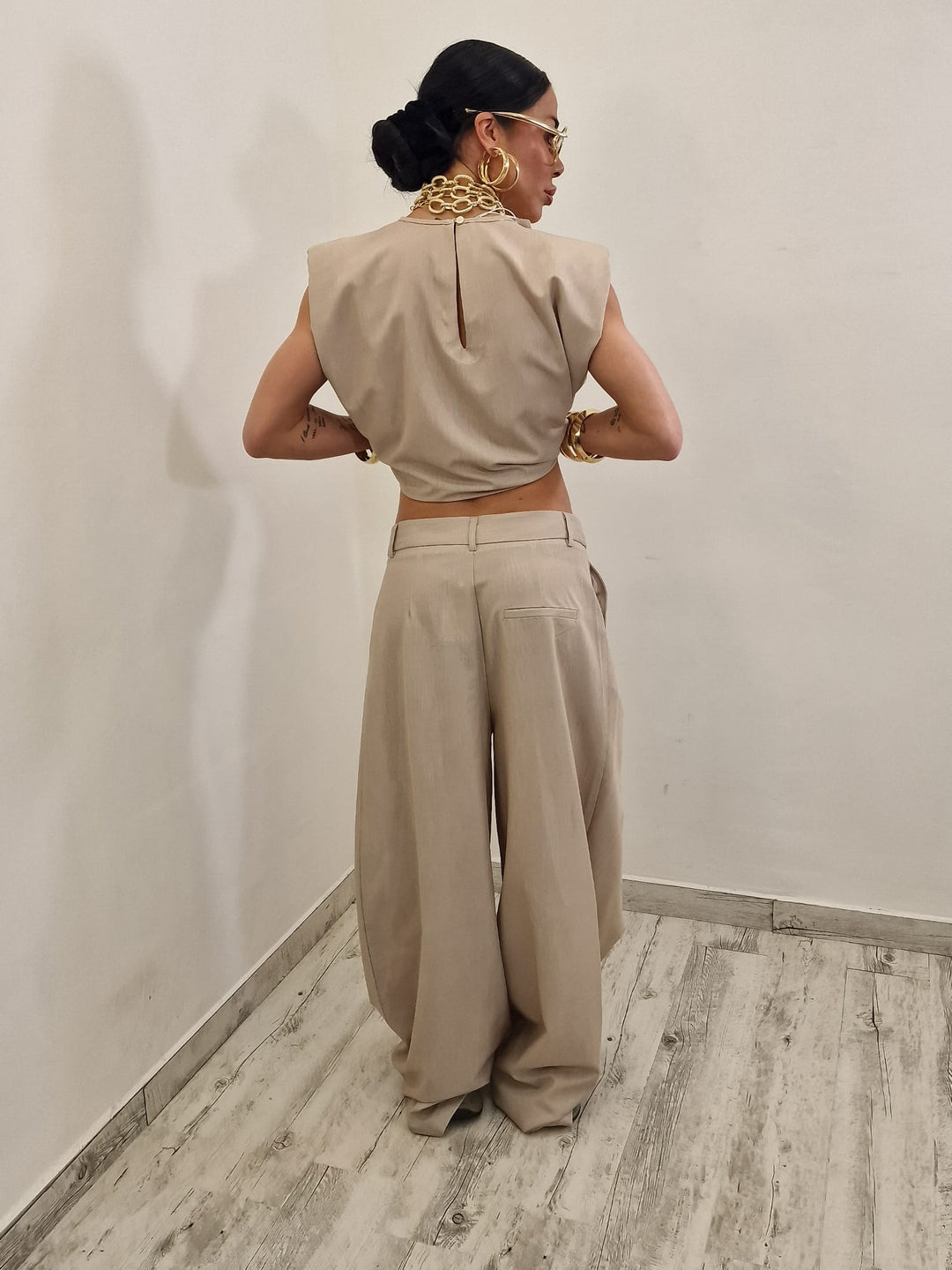 Sleeveless ruffled top + asymmetrical pants