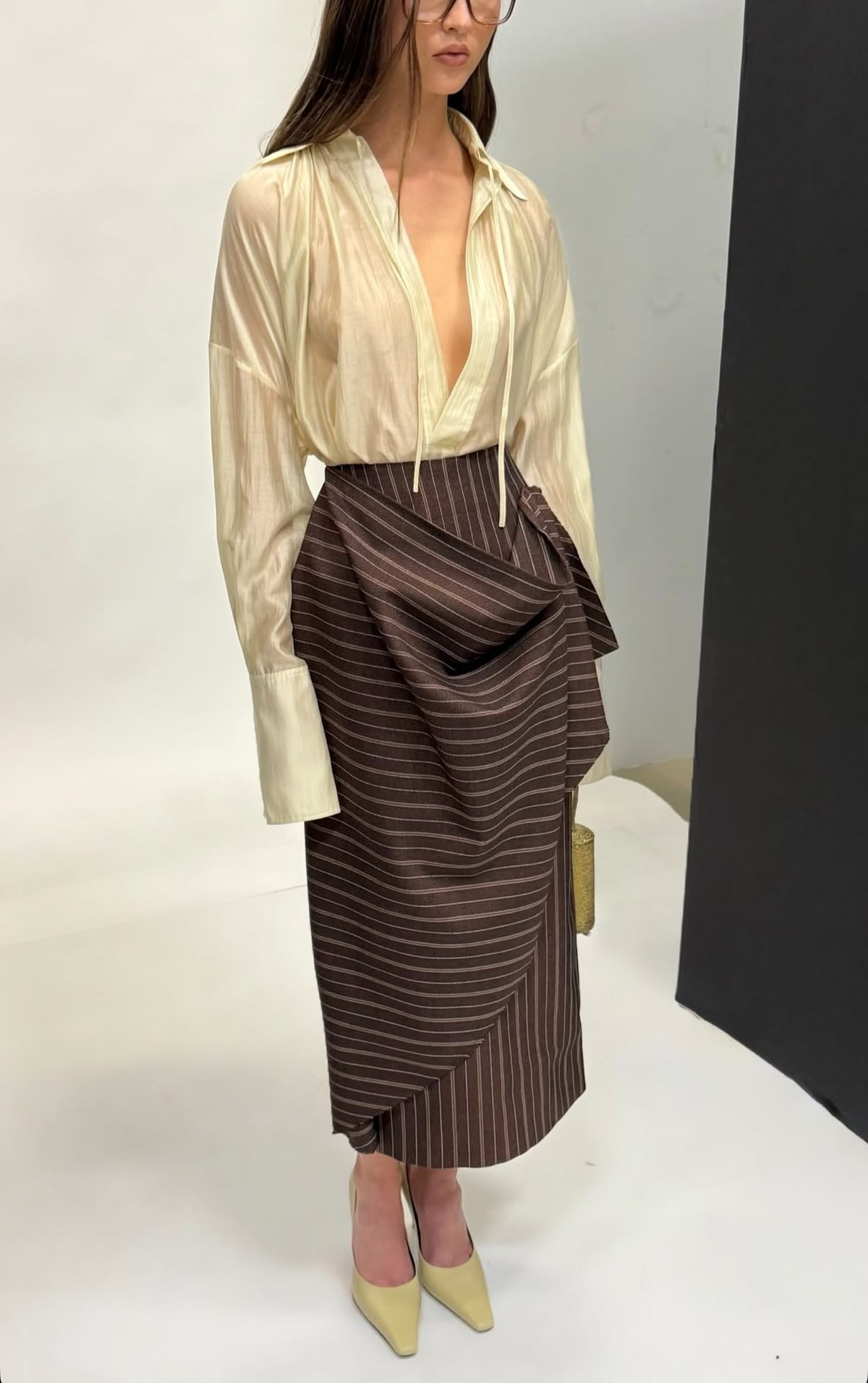 Stand-up collar shirt + pleated asymmetrical skirt