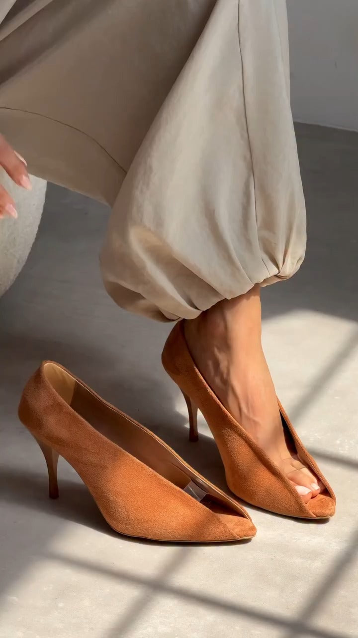 Asymmetrical high heels
